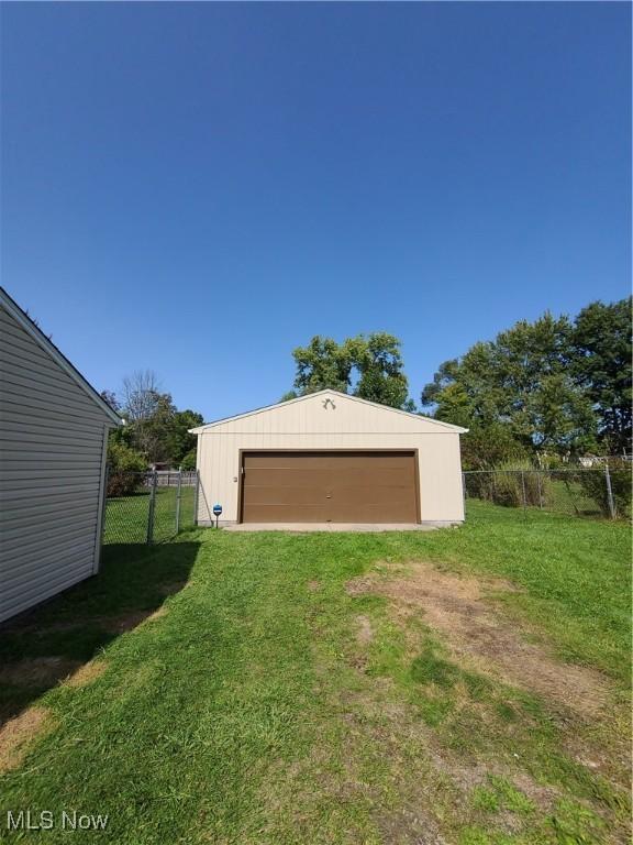 garage featuring a yard