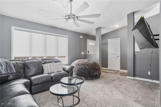 living room featuring a textured ceiling, carpet floors, vaulted ceiling, and ceiling fan