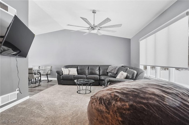 living room featuring light wood-type flooring, vaulted ceiling, and ceiling fan