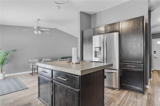 kitchen with a kitchen island, stainless steel refrigerator with ice dispenser, ceiling fan, and light hardwood / wood-style floors