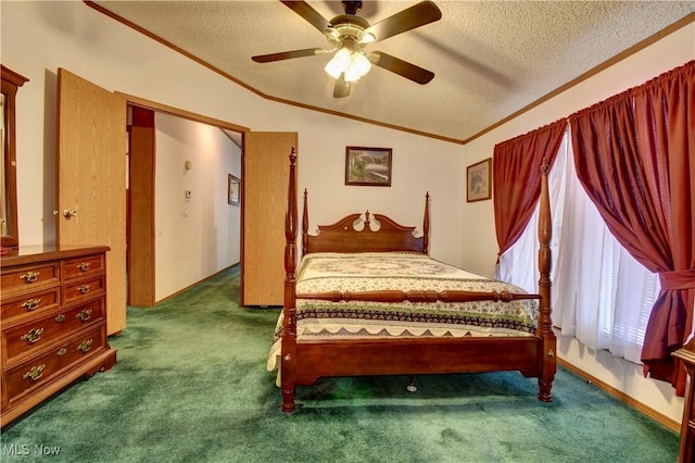 bedroom featuring vaulted ceiling, ceiling fan, dark colored carpet, a textured ceiling, and ornamental molding