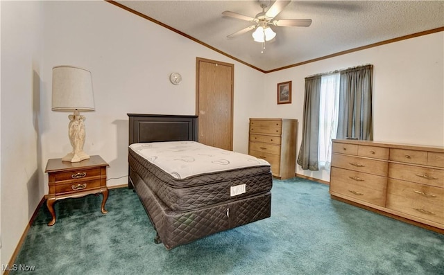 carpeted bedroom featuring a textured ceiling, vaulted ceiling, ceiling fan, and ornamental molding