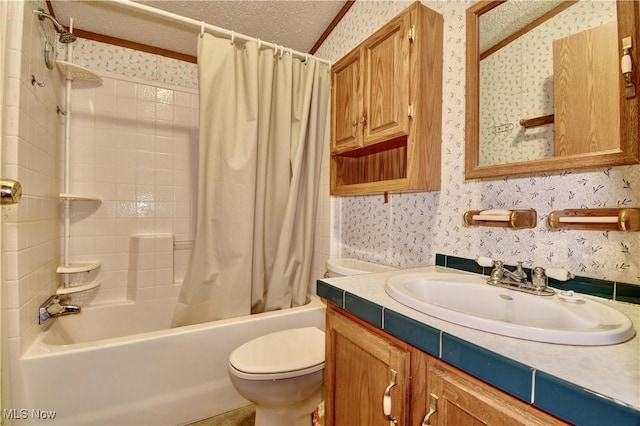 full bathroom featuring vanity, toilet, a textured ceiling, and shower / tub combo with curtain