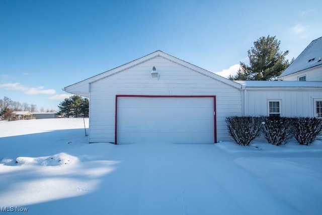 view of snow covered garage