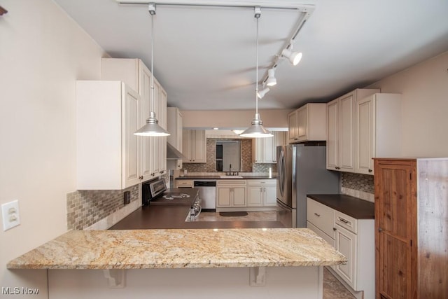 kitchen featuring kitchen peninsula, a kitchen breakfast bar, hanging light fixtures, and appliances with stainless steel finishes