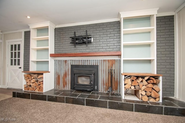 interior details with carpet floors, a wood stove, and ornamental molding