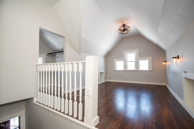2040 E Middletown Rd, Poland, OH 44514 - bonus room featuring lofted ceiling, wood-type flooring, and baseboards