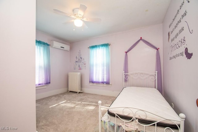 bedroom with an AC wall unit, carpet, radiator heating unit, and ceiling fan