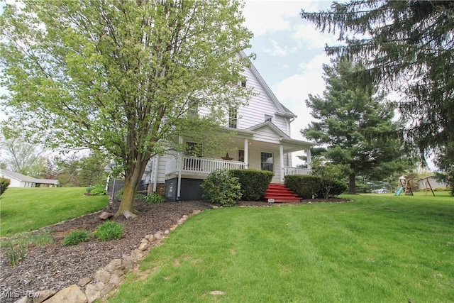 2040 E Middletown Rd, Poland, OH 44514 - view of front facade featuring covered porch, a front yard, and stairs