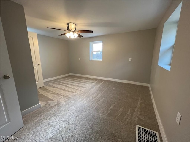 carpeted empty room with ceiling fan