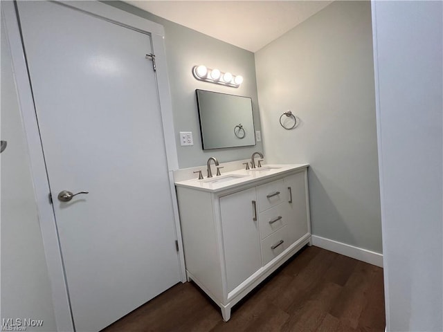 bathroom with vanity and hardwood / wood-style flooring