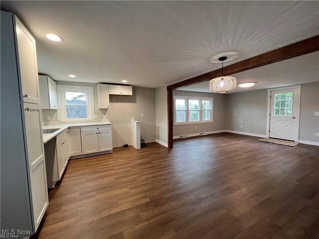 kitchen with white cabinets, decorative light fixtures, dishwasher, and dark hardwood / wood-style flooring