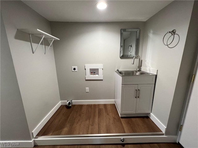 laundry area with washer hookup, sink, electric dryer hookup, and dark wood-type flooring