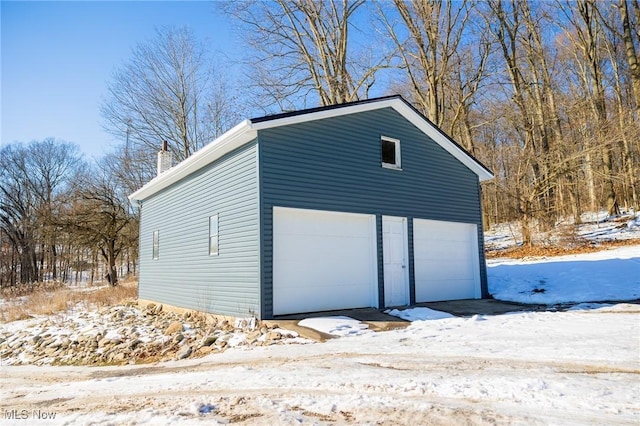 view of snow covered garage