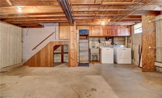 basement featuring washing machine and clothes dryer