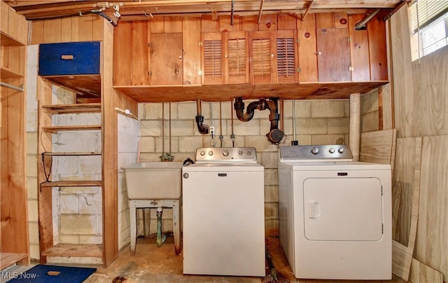 laundry room featuring sink and washing machine and clothes dryer