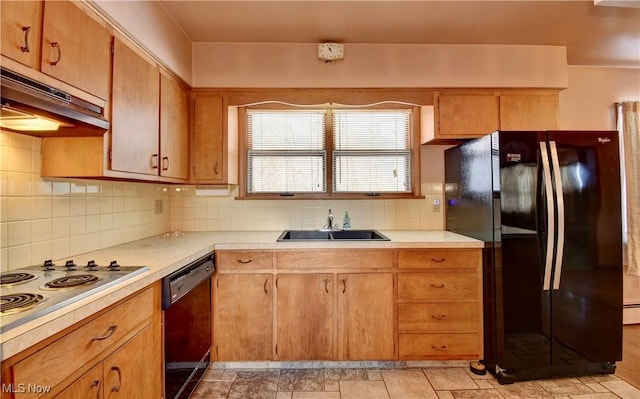 kitchen with sink, black appliances, exhaust hood, and tasteful backsplash