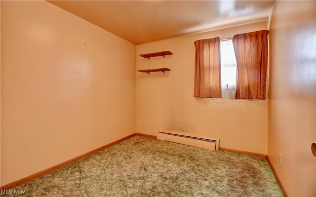 carpeted spare room featuring a baseboard radiator