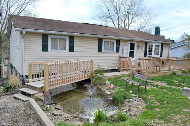 view of front of home with a wooden deck