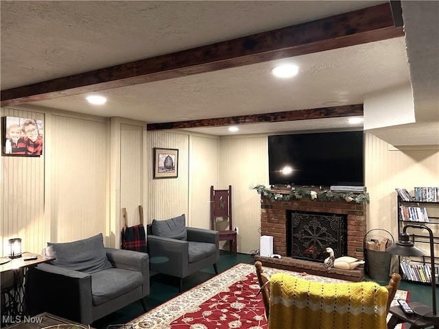 living room with a textured ceiling and a fireplace