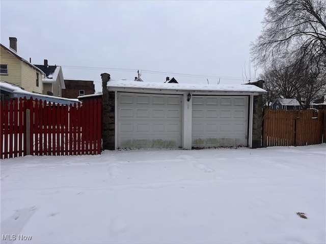 view of snow covered garage