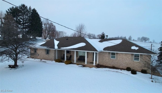 view of snow covered house