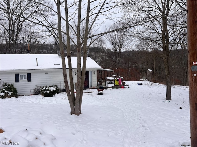 view of yard covered in snow