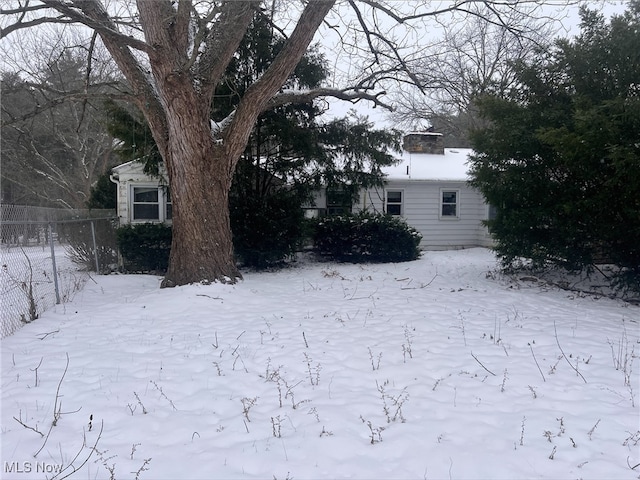 view of yard covered in snow