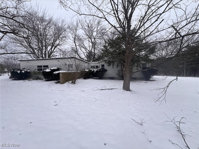 view of yard layered in snow