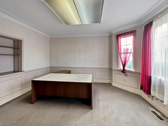 carpeted office space featuring ornamental molding