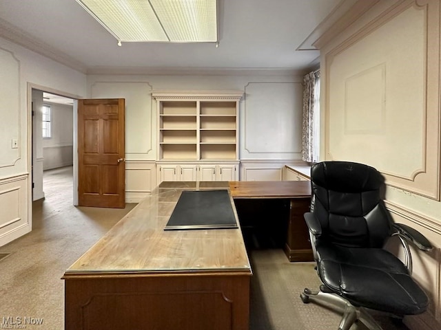 carpeted home office with crown molding