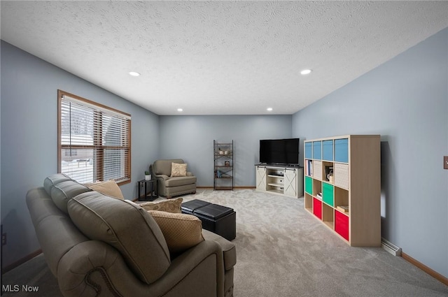 carpeted living room featuring a textured ceiling