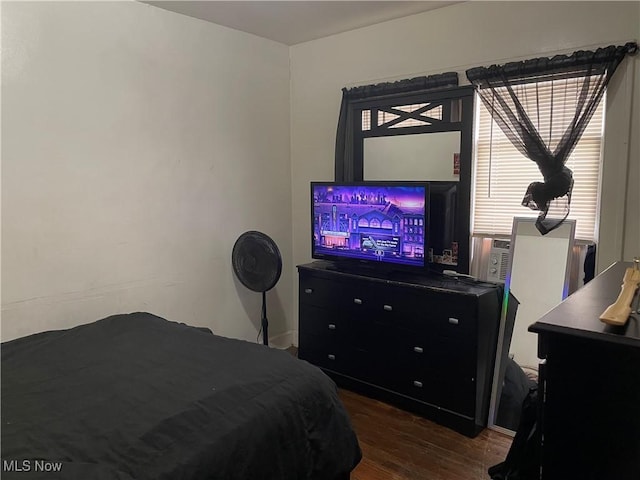 bedroom featuring dark hardwood / wood-style flooring