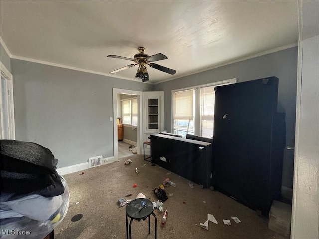 interior space with ceiling fan and ornamental molding