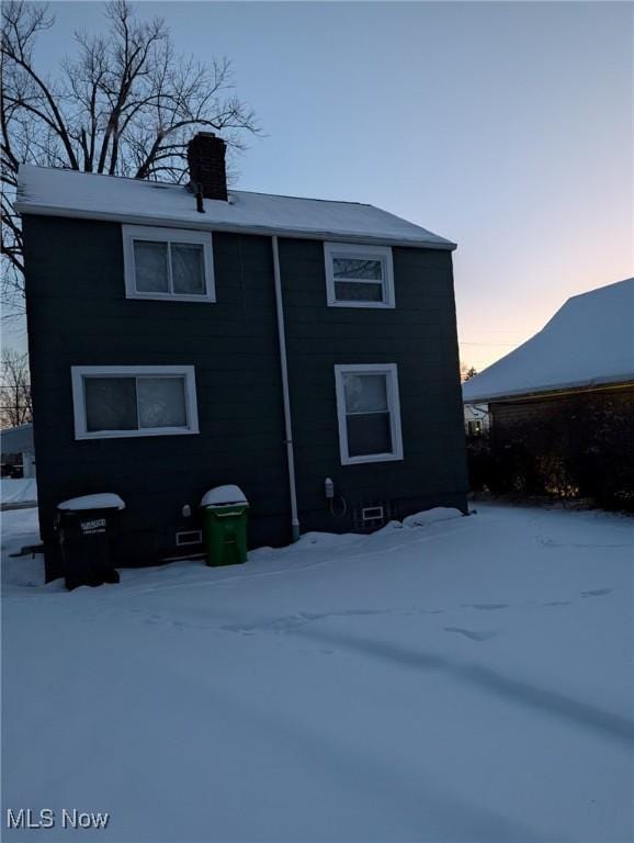 view of snow covered house