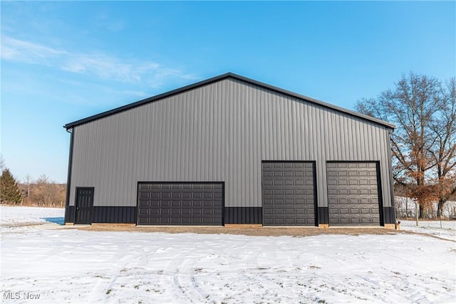 view of snow covered garage