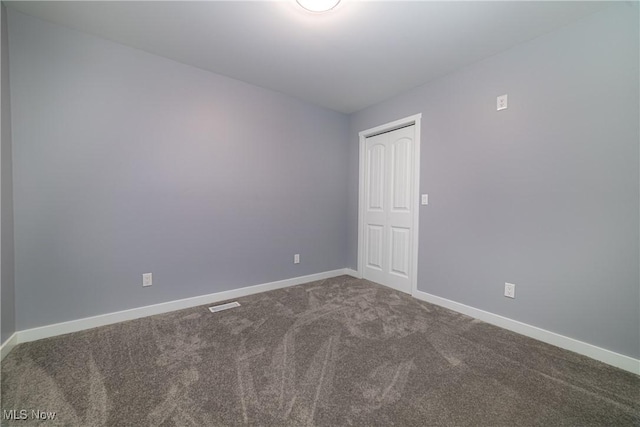 unfurnished room with carpet floors