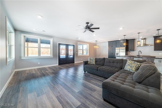 living room featuring sink, french doors, ceiling fan, and dark hardwood / wood-style flooring