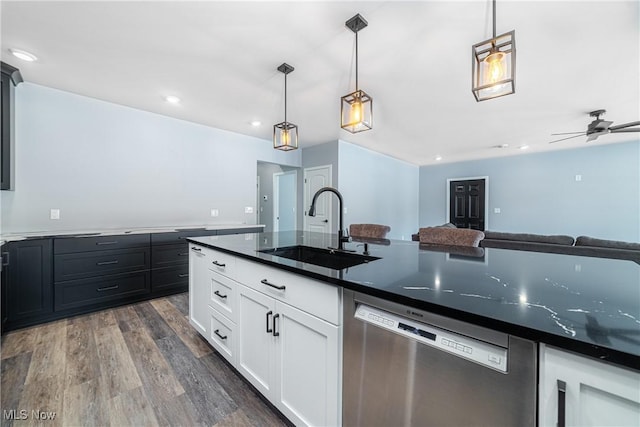 kitchen featuring sink, decorative light fixtures, white cabinetry, and dishwasher