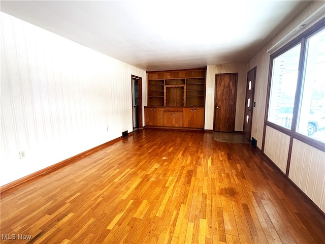 unfurnished bedroom with wood-type flooring