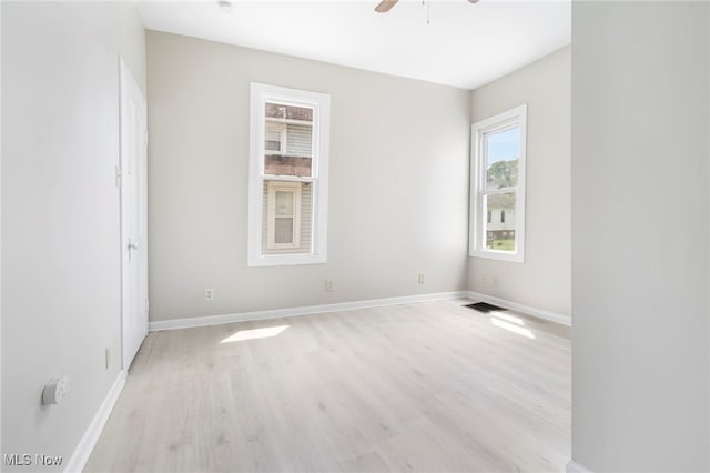 unfurnished room featuring ceiling fan and light hardwood / wood-style floors