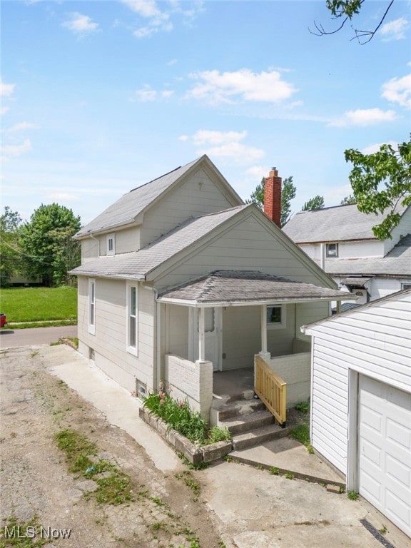 view of side of property with a porch