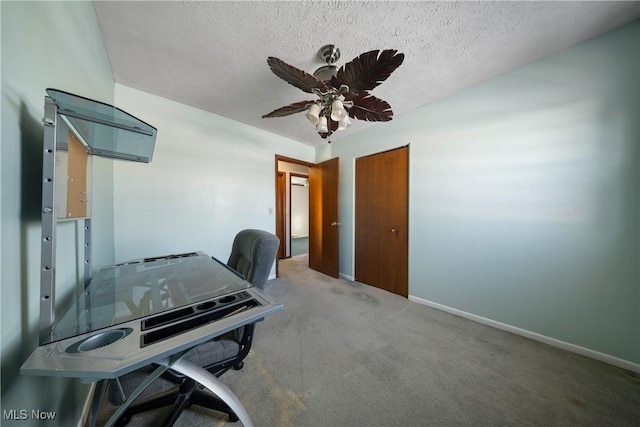 office featuring ceiling fan, a textured ceiling, and carpet flooring