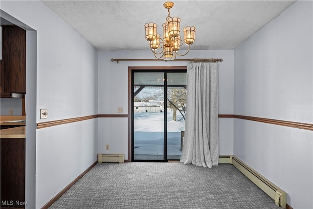 unfurnished room with carpet floors, a chandelier, baseboard heating, and a textured ceiling