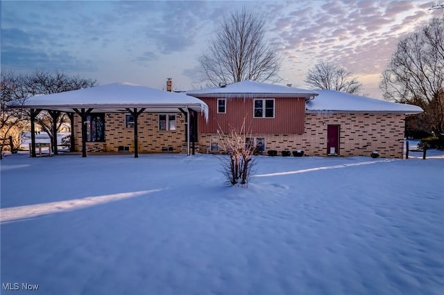 view of snow covered property