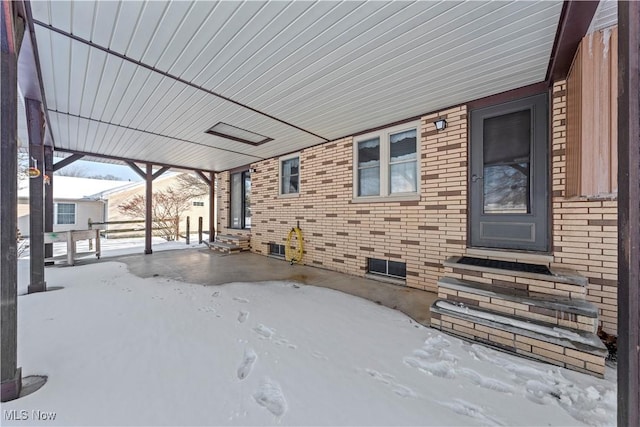 view of snow covered patio