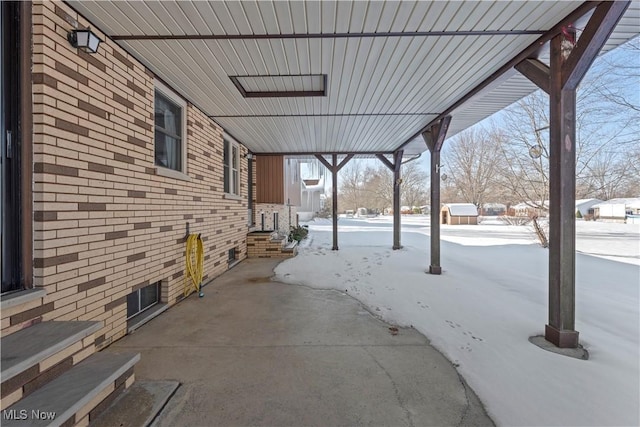 view of snow covered patio