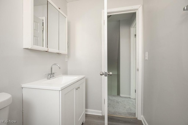 bathroom with toilet and vanity