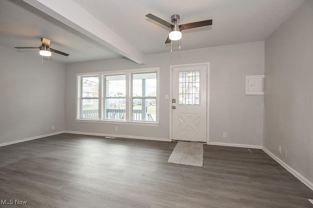 foyer with ceiling fan, beam ceiling, and dark wood-type flooring