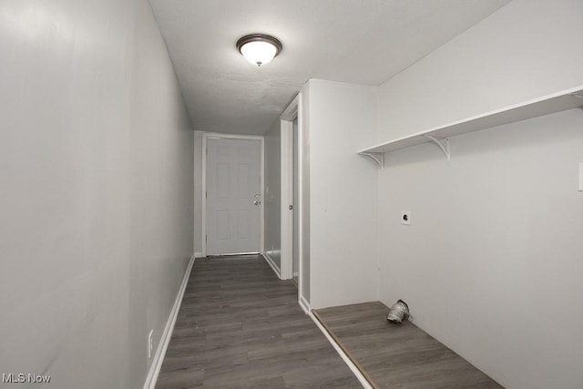 washroom with hookup for an electric dryer and dark hardwood / wood-style floors